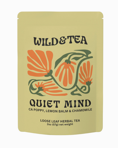 Yellow package of Wild & Tea Quiet Mind herbal tea with floral design